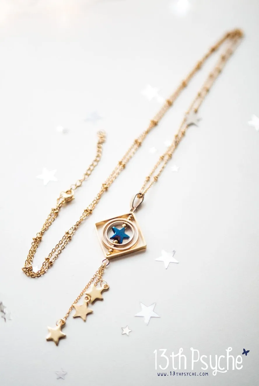 Space inspired shooting star spinner necklace